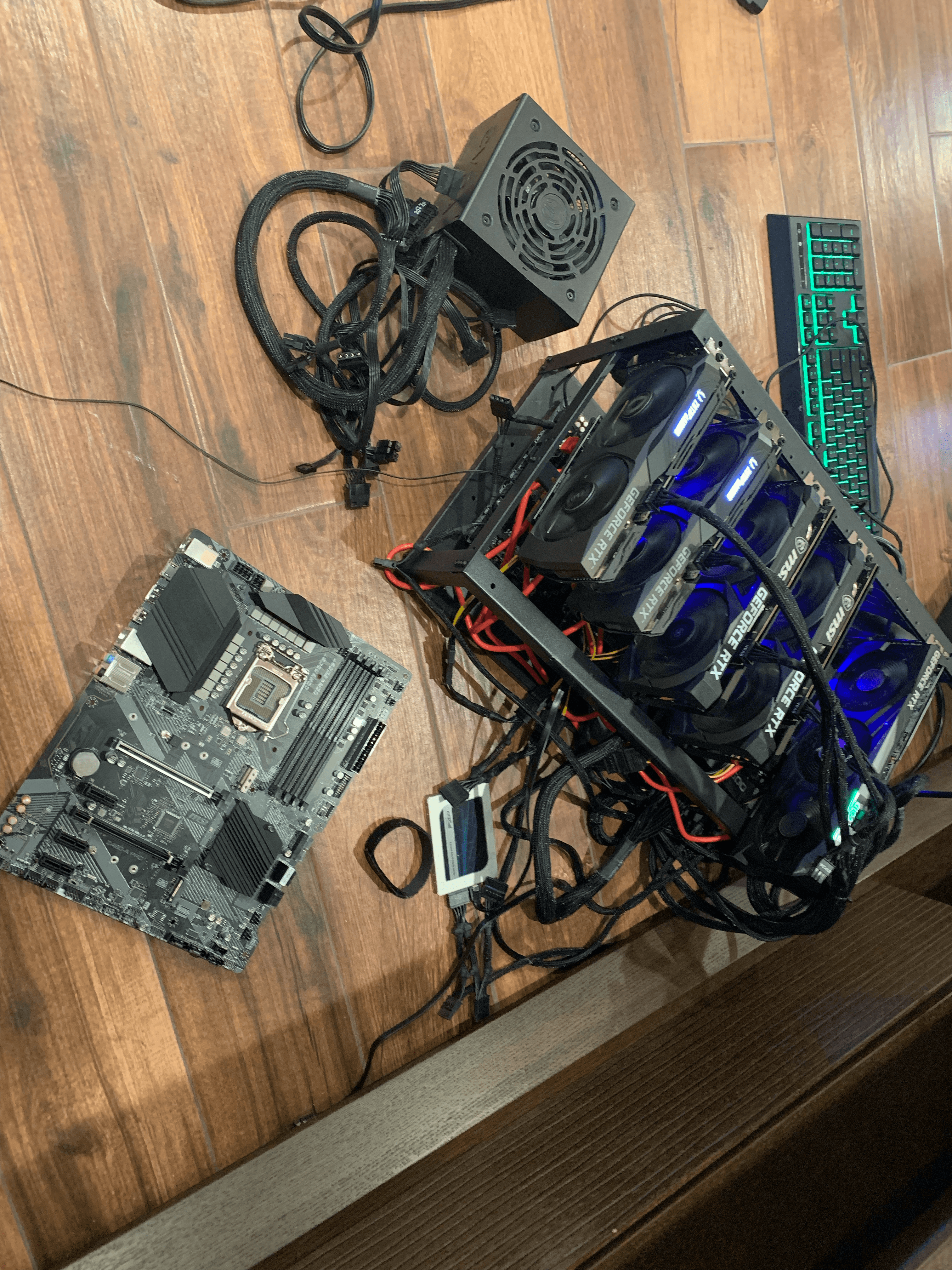 Bitcoin mining rig operation with GPUs and equipment.